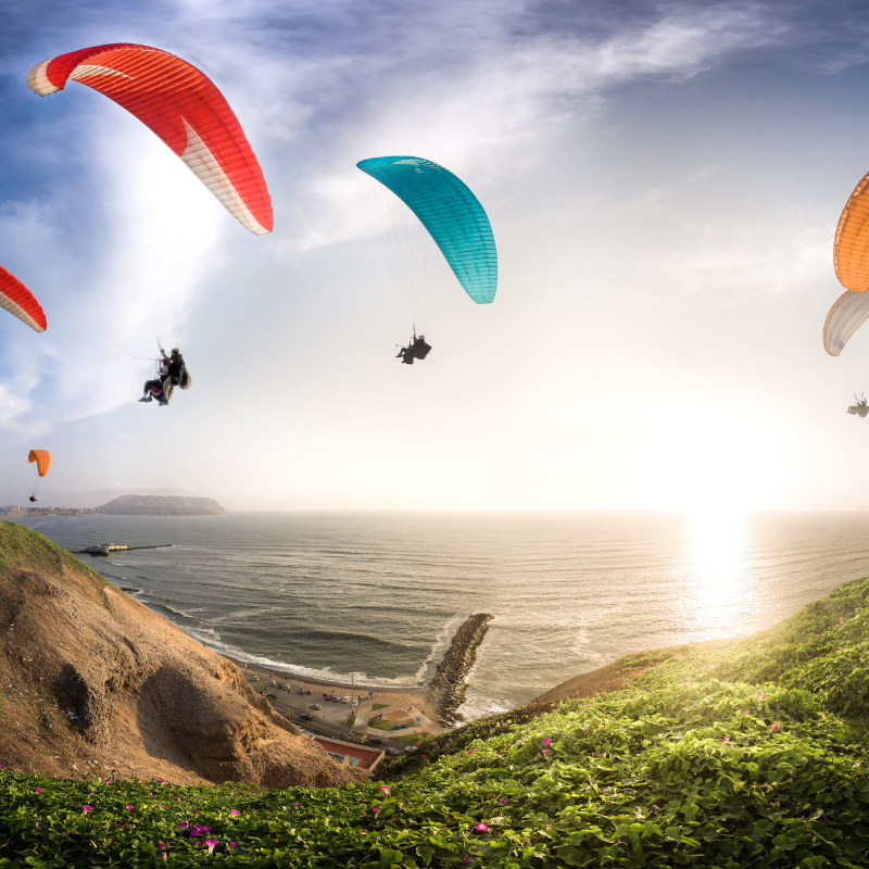 Paragliding over the mountains during an adventure trip in Nepal , Mountain biking through Nepalese trails in the Himalayas